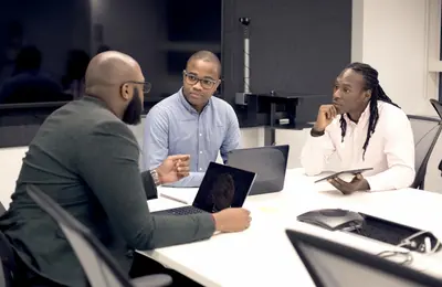 Colleagues discussing during a business meeting
