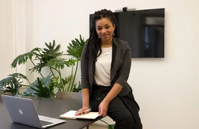 Businesswoman working with a laptop and notebook in an office